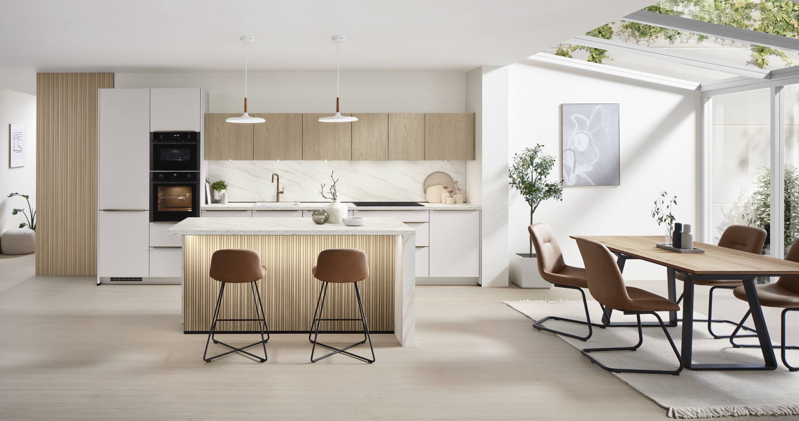Bright and airy kitchen with white and wood cabinets, an island with wood slat detailing, and a separate dining area.