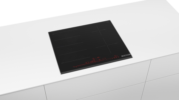 Black glass Bosch induction cooktop with red digital display, integrated into a white countertop.