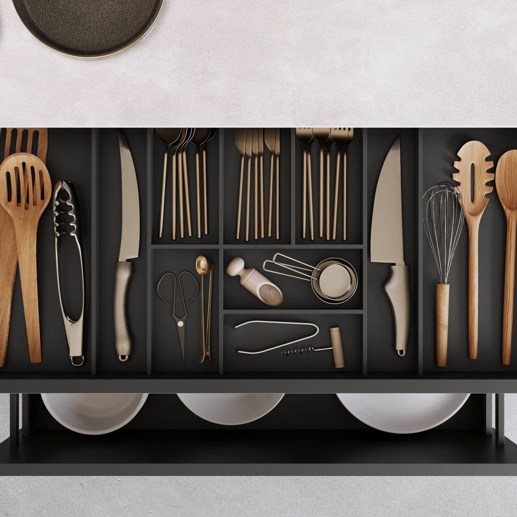Open kitchen drawer using the new nBOX design with organized cutlery, utensils, and cooking tools in designated compartments.