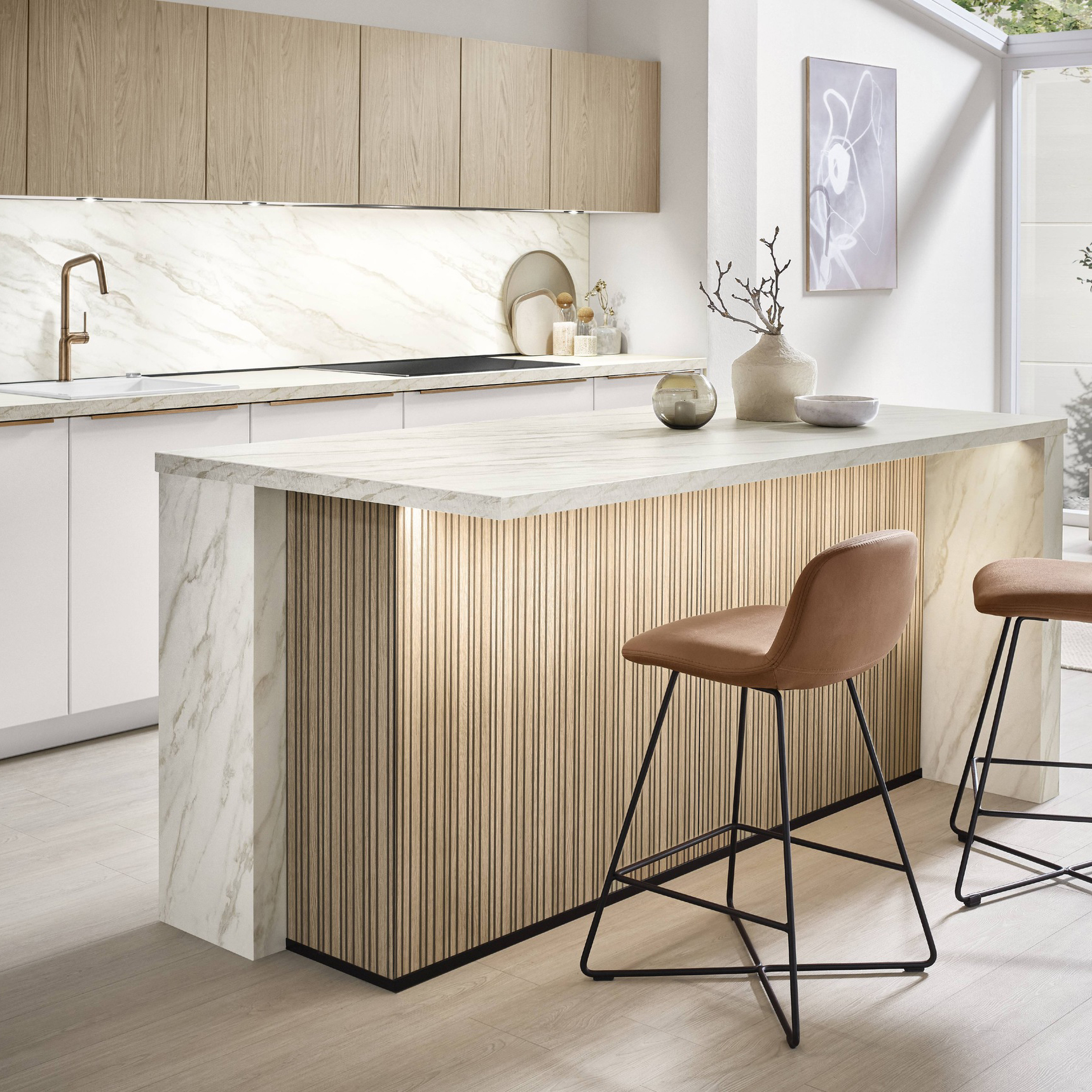 Modern white and wood kitchen with a textured island and brown bar stools.