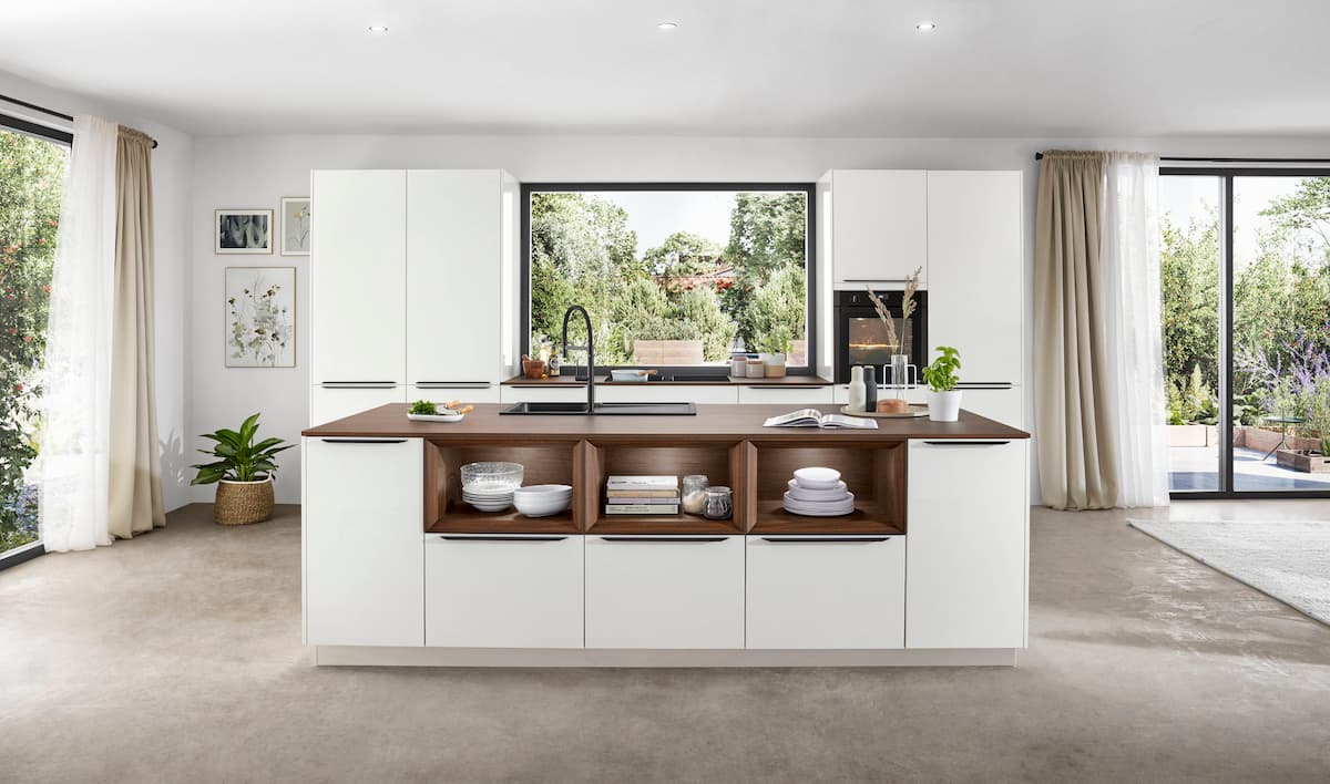 A bright, contemporary kitchen island with open shelving and wood accents, perfect for open-concept designs.