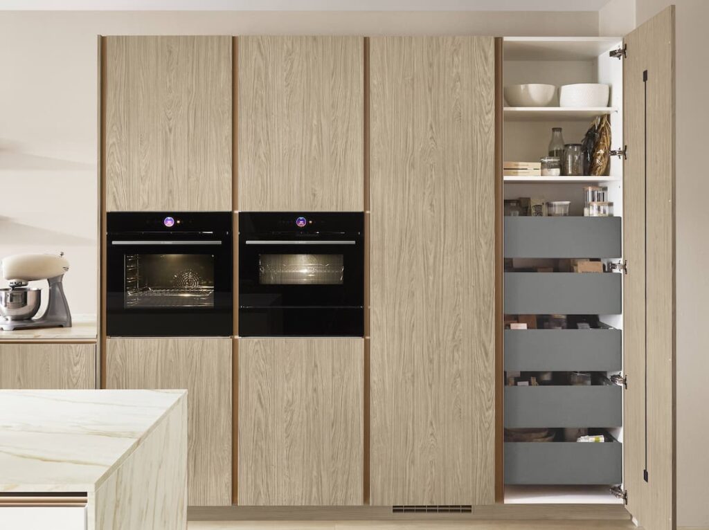 Custom-built tall unit kitchen furniture in Bangkok showcasing clever storage drawers and integrated shelving for modern living.