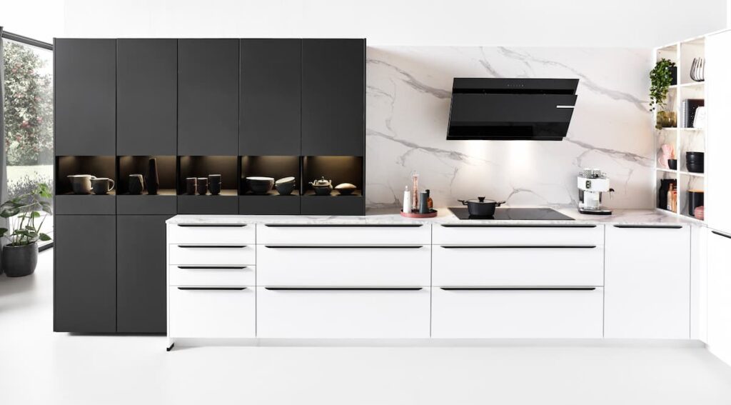 Elegant kitchen top idea featuring a white marble countertop paired with black cabinetry for a sophisticated look.
