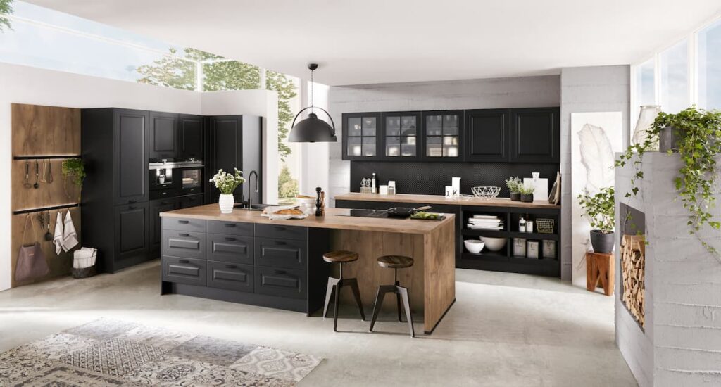 A rustic black kitchen island design with a wooden countertop and seating, blending style and function.