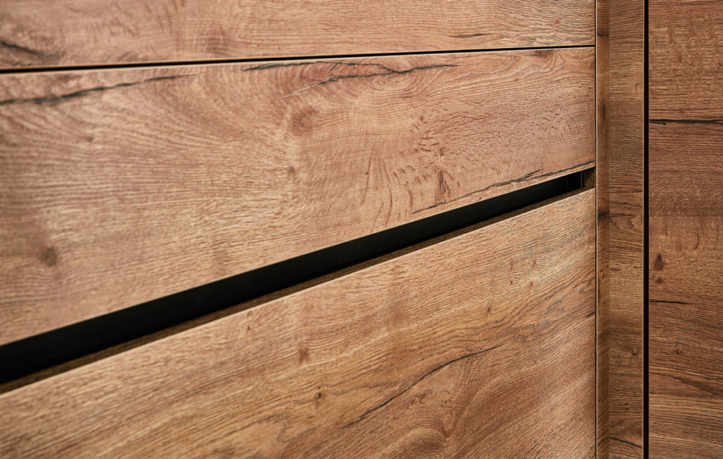 Close-up of wood grain kitchen cabinets designed by a top kitchen designer in Thailand.